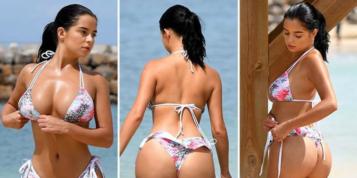 Demi Rose Strikes Her Poses In A Tiger-Print Bikini
